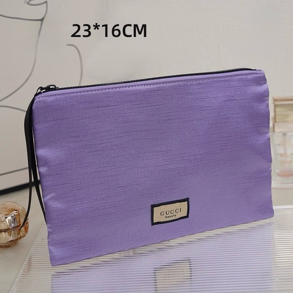Gucci Handbags - Gucci Beauty Purple Shimmer Floral Inside Zip Pouch